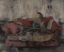 a rugged couch with a lamp and a table tumbled on it